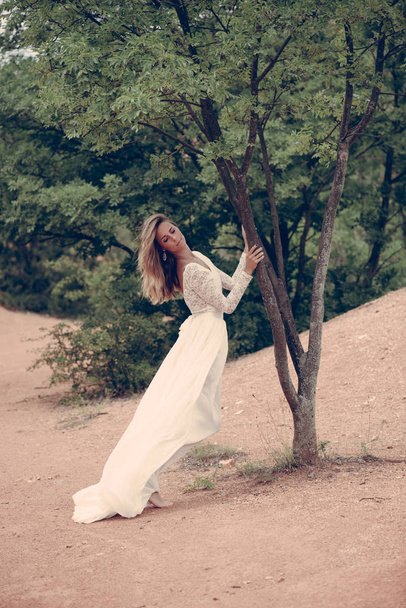 Young bride standing outdoor - Zdjęcie, obraz