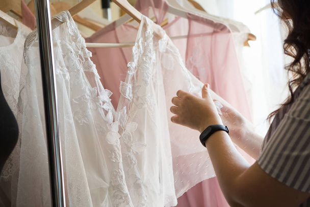 Dress designer making lace wedding dresses.  - Foto, imagen