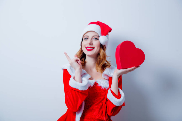 Santa  girl with heart shape gift - Photo, Image