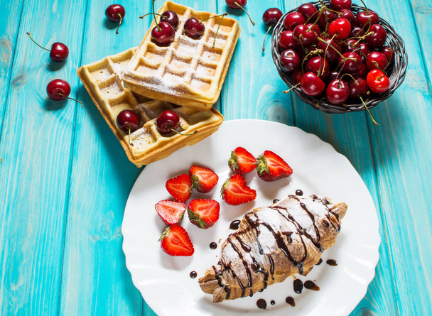 Breakfast : waffles and croissant with cherries and strawberries - Photo, Image