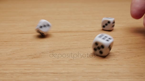 Dice rolling on the table. Close-up. - Materiaali, video
