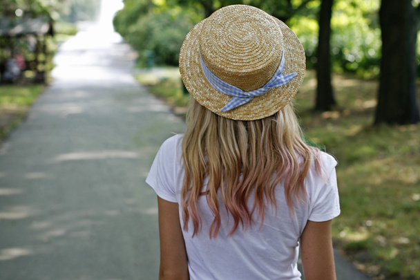 A girl in a hat on a walk - Photo, Image