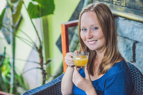  woman  drinking morning ginger tea - Zdjęcie, obraz