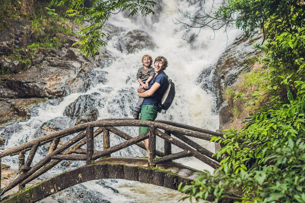 Father and son near Datanla waterfall  - Valokuva, kuva