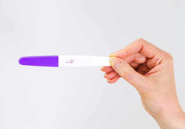 Woman holding negative pregnancy test. - Zdjęcie, obraz