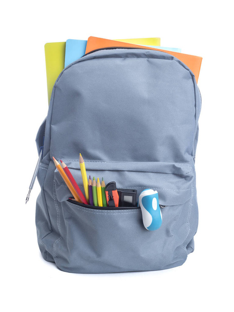 Grey backpack with school supplies - Фото, изображение