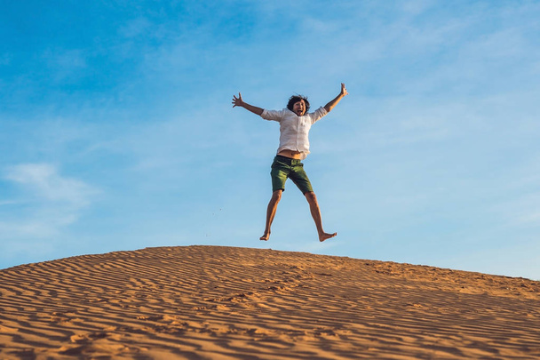 young man jumping barefoot  - Foto, afbeelding