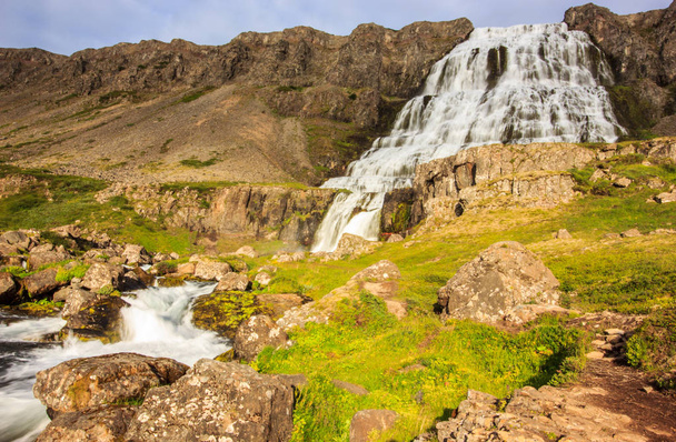 The beautiful summer view of Dynjandifoss (Dynjandi Waterfall), jewels of the Westfjords, Iceland. The biggest waterfall in Westfjords. - Valokuva, kuva