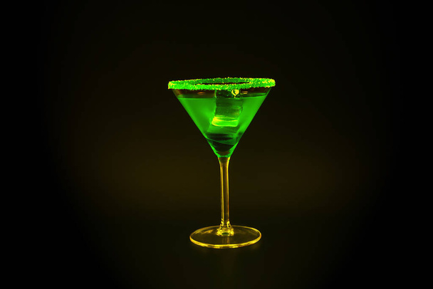 Colorful drink in a cocktail glass, with ice cubes, summer drink - Foto, imagen