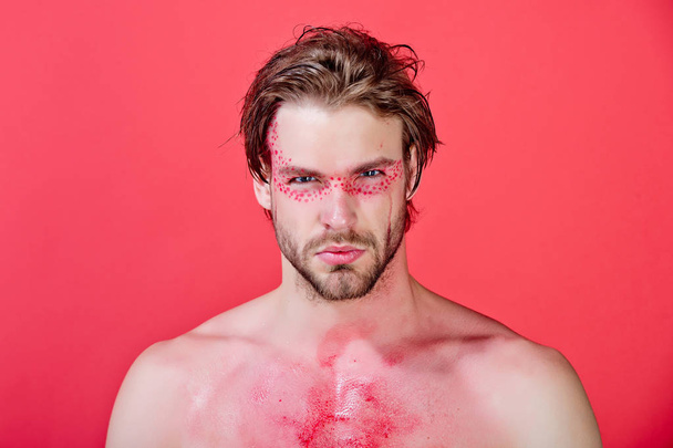 man with creative fashionable makeup on red background - Фото, зображення