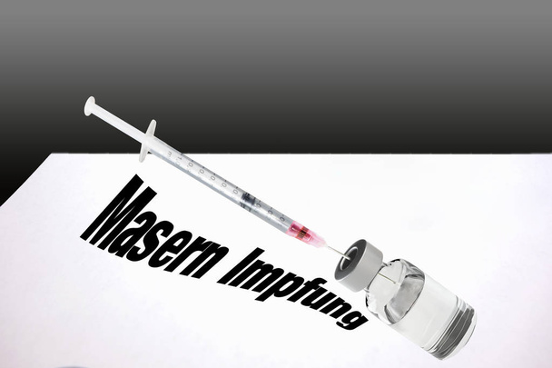 Syringe is filled with vaccine for measles vaccination.       - Photo, Image
