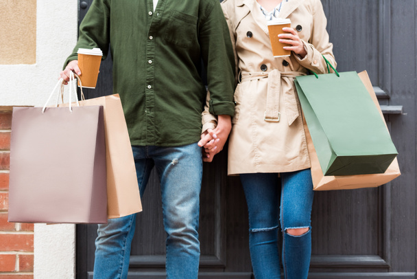 couple with shopping bags on street - Photo, Image