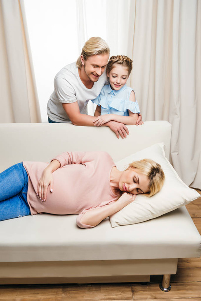 pregnant woman sleeping on sofa - Foto, Imagen