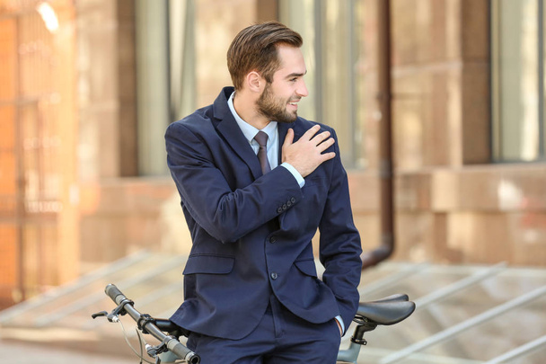 young businessman with bicycle  - Zdjęcie, obraz
