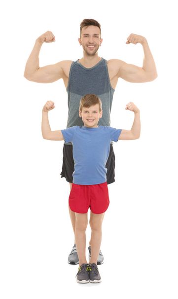 Dad and son showing muscles  - Φωτογραφία, εικόνα