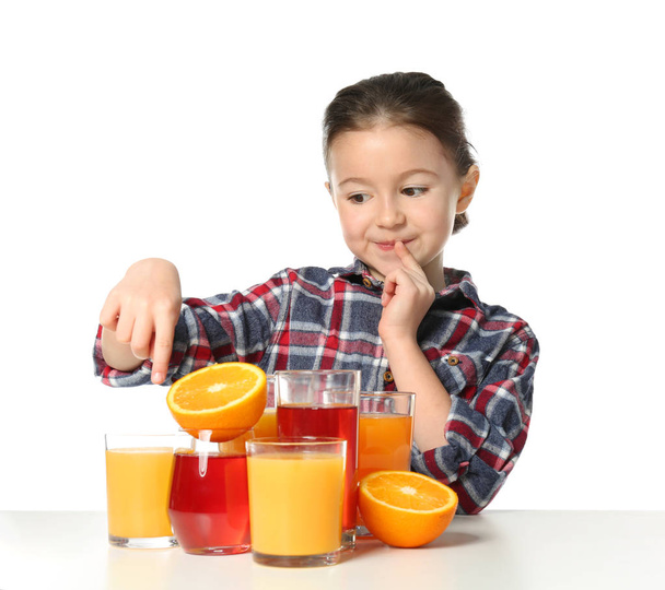 Cute little girl with glasses of juice - Foto, afbeelding