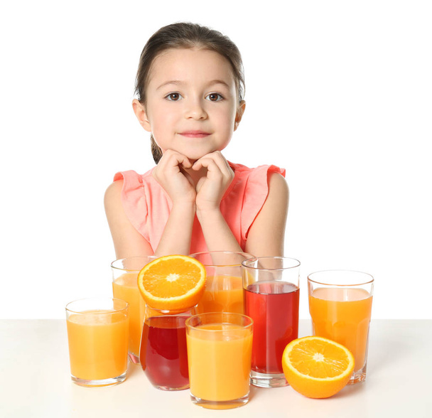 Cute little girl with glasses of juice - Valokuva, kuva
