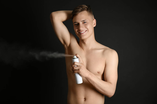 young man with deodorant - Fotoğraf, Görsel