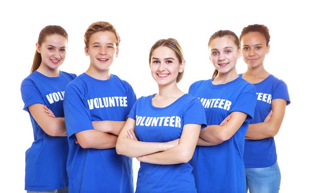 Group of young volunteers on white background - Фото, зображення