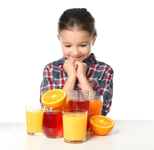 Cute little girl with glasses of juice - Фото, зображення