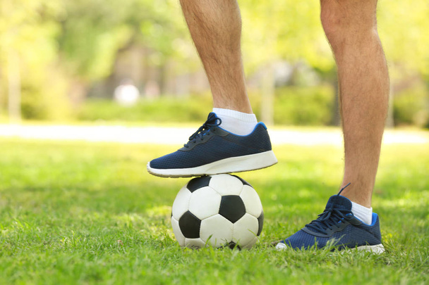 Legs of young man with soccer ball  - Fotoğraf, Görsel