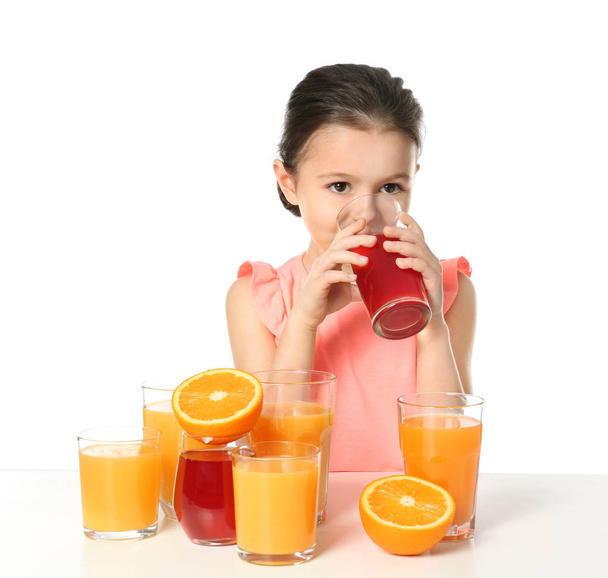 Cute little girl with glasses of juice - Valokuva, kuva