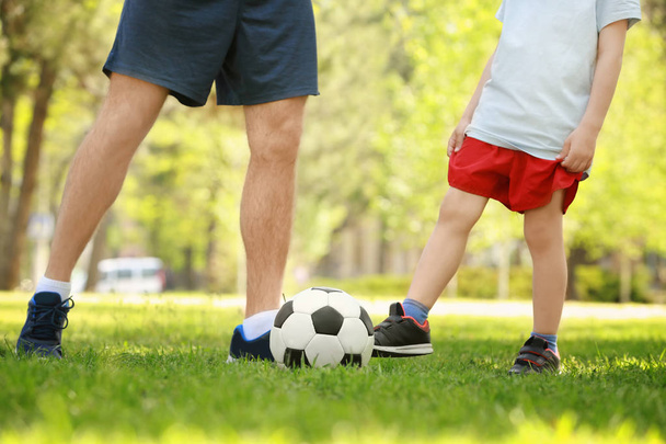 Father and son playing football  - Foto, Bild