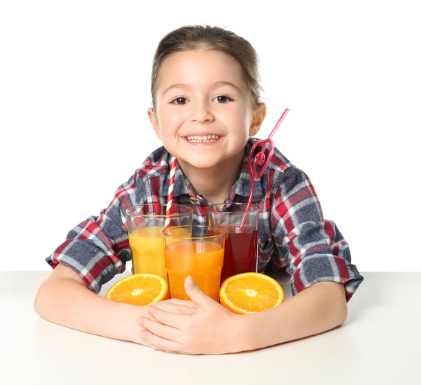 Cute little girl with glasses of juice - Foto, imagen