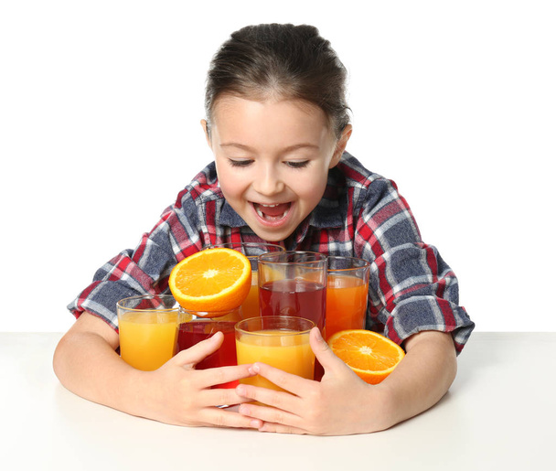Cute little girl with glasses of juice - 写真・画像