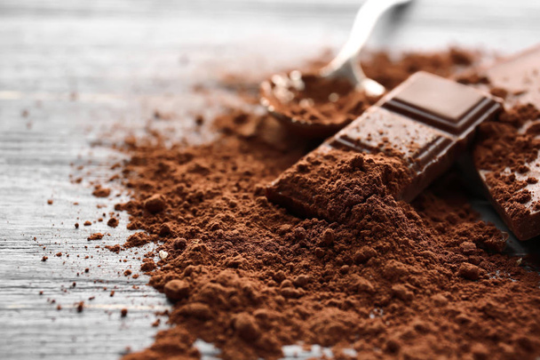 Chocolate pieces with cocoa powder  - Φωτογραφία, εικόνα