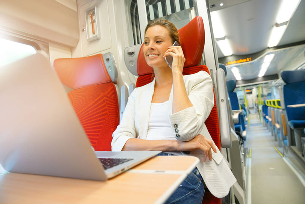 Businesswoman in train working - Fotoğraf, Görsel