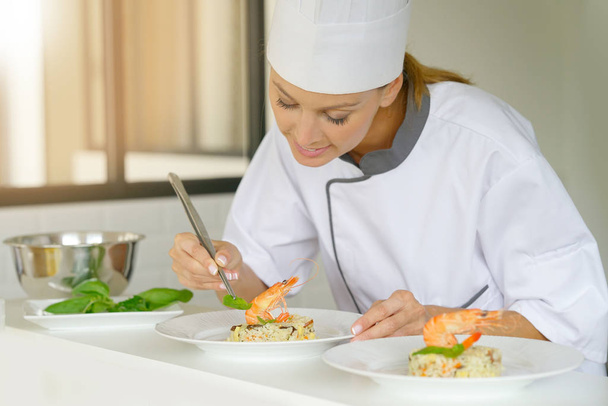 Chef preparing dish  - Фото, изображение