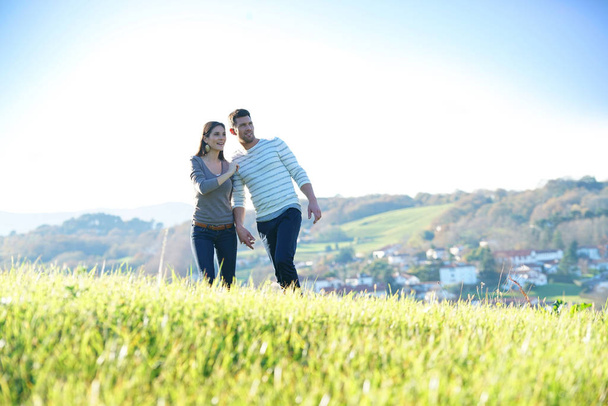 Couple walking in countryside  - Fotoğraf, Görsel