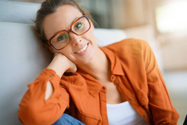 girl with trendy eyeglasses sitting - Фото, изображение