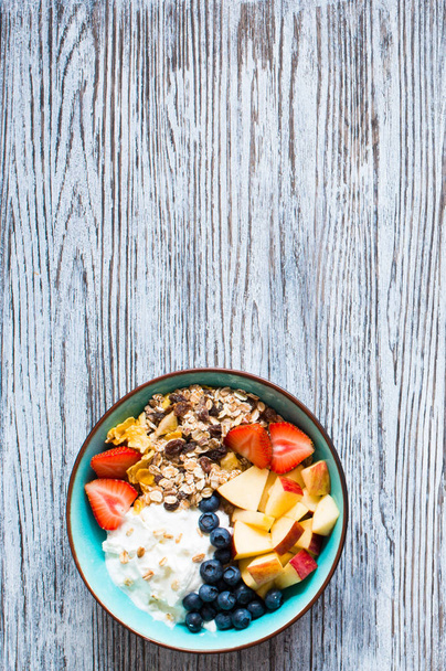 Healthy breakfast, cereal with yogurt, strawberries, blueberry,  - 写真・画像
