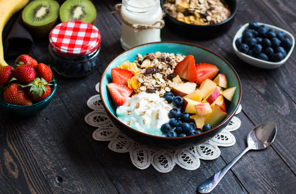 Healthy breakfast, cereal with yogurt, strawberries, blueberry,  - 写真・画像