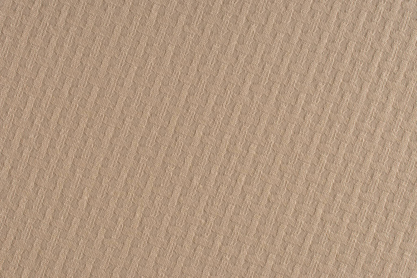 close up of a woolen fabric of beige color.  - 写真・画像