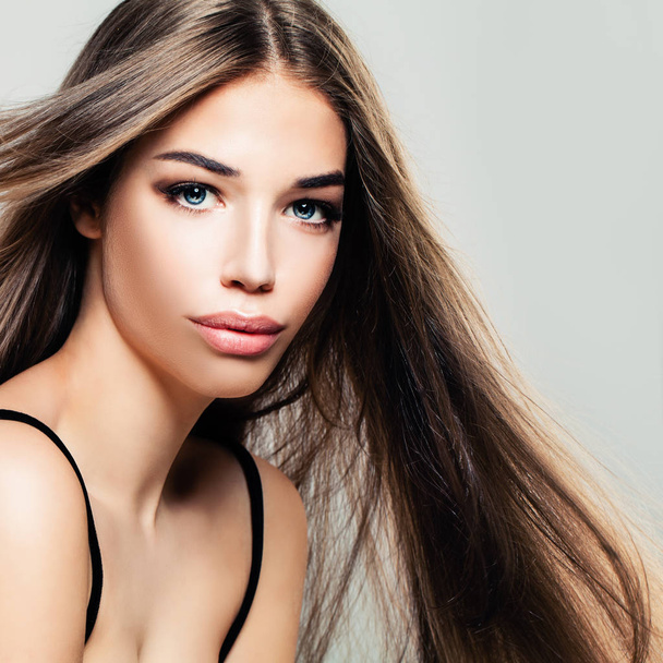 Young Cute Woman with Long Healthy Hair. Pretty Face, Makeup - Fotografie, Obrázek