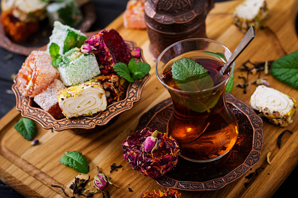 Bowl with turkish delight and black tea - Photo, Image