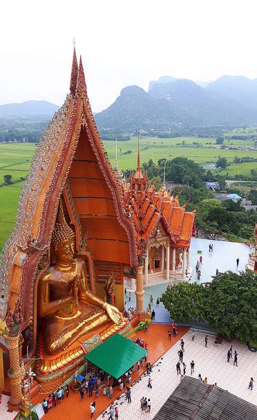 KANCHANABURI, THAILAND - NOVEMBER 7, 2015: Big golden Buddha from top view at Wat Tham Suea, meaning `Tiger cave temple` - Foto, Imagen
