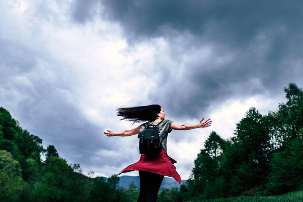 Woman with cloudy sky - Photo, Image