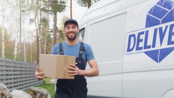 Smiling Delivery Man Comes Out of His Cargo Van with Cardboard Boxes and Goes Towards Camera. - Metraje, vídeo