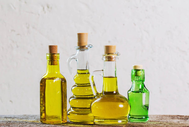 Olive oil  on the wooden table - Foto, Imagen