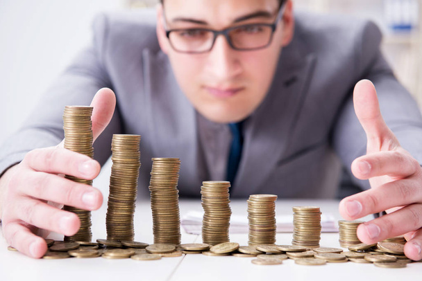 Businessman with golden coins in business growth concept - Photo, Image