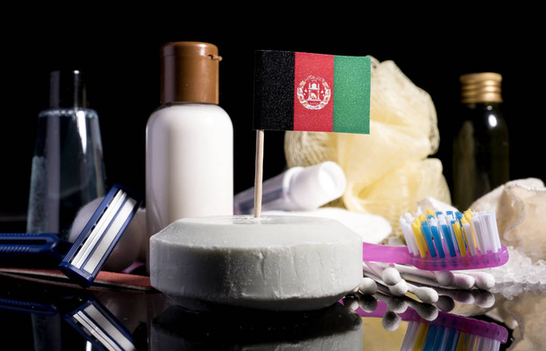 Флаг Афганистана в мыле со всеми продуктами для гигиены людей
 - Фото, изображение