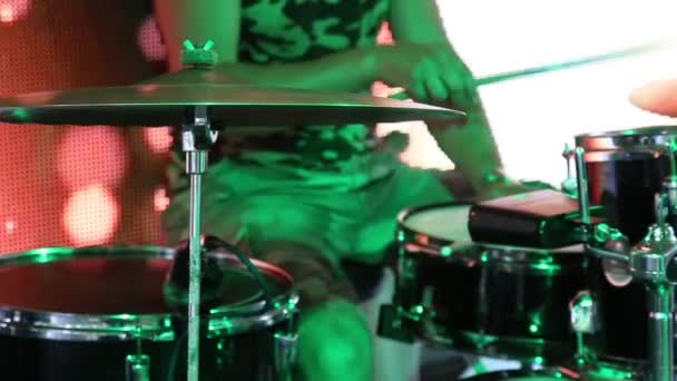 Man drummer playing on a drums on a concert close up. - Felvétel, videó