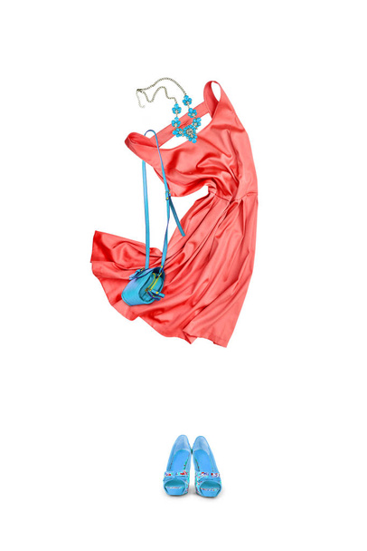Summer outfit.On a white background, women's clothes with a bag in the shape of a female figure are arranged. - Photo, Image
