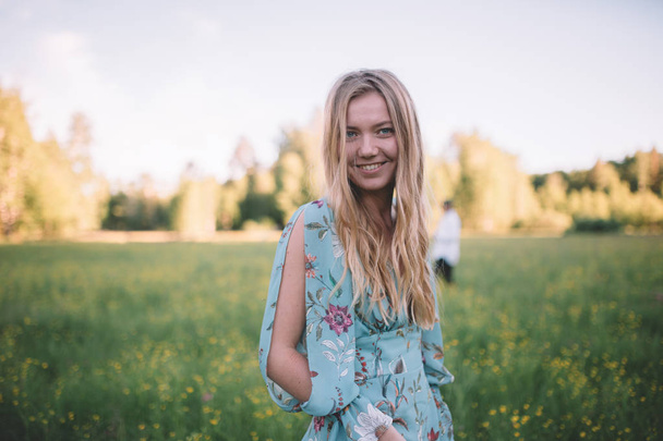 Hippie blonde hair girl in a colourful dress during her wedding day - Foto, Imagen