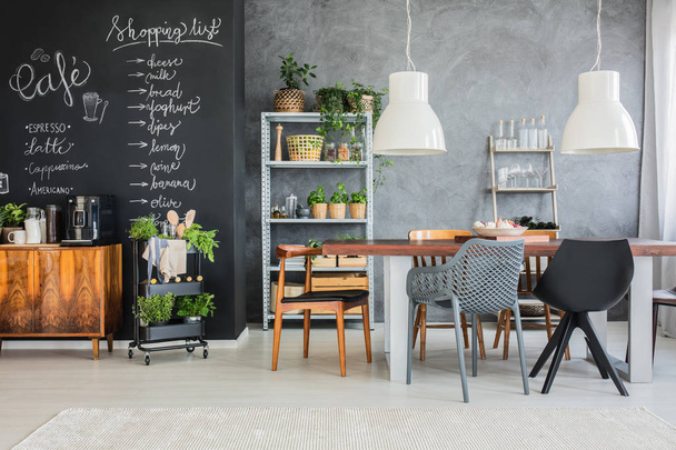 Family table in industrial kitchen - 写真・画像