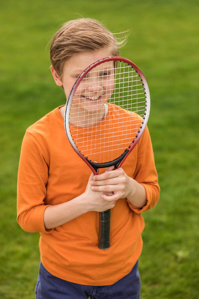 Boy with badminton racquet  - Foto, Imagem